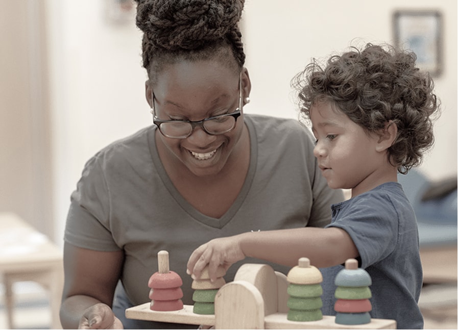 A person playing a game with a child