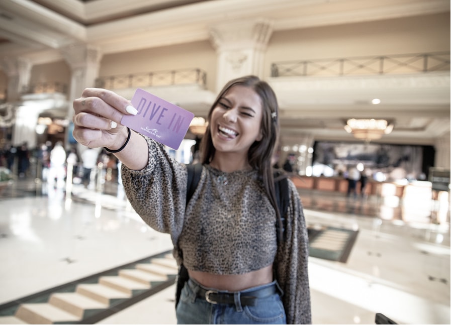 A person holding a card towards the camera